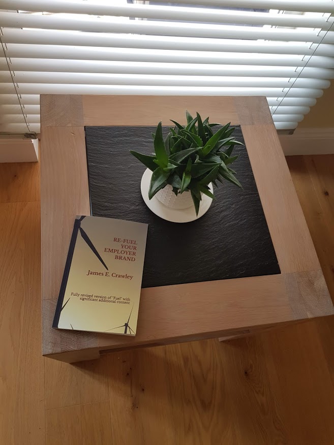 Re-Fuel Your Employer Brand by James E. Crawley photographed on a table